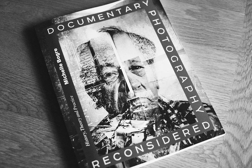A photography textbook, Documentary Photography Reconsidered: History, Theory and Practice by Michelle Bogre.